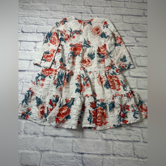 Franchesca’s Miami Little Girls Dress in White and Red Floral. Long
Sleeves. - Picture 7 of 7